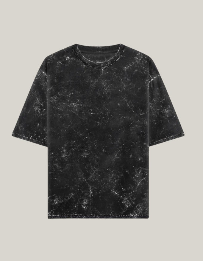StrykDrift black acid wash oversized crew neck t-shirt with a vintage lived-in streetwear aesthetic.